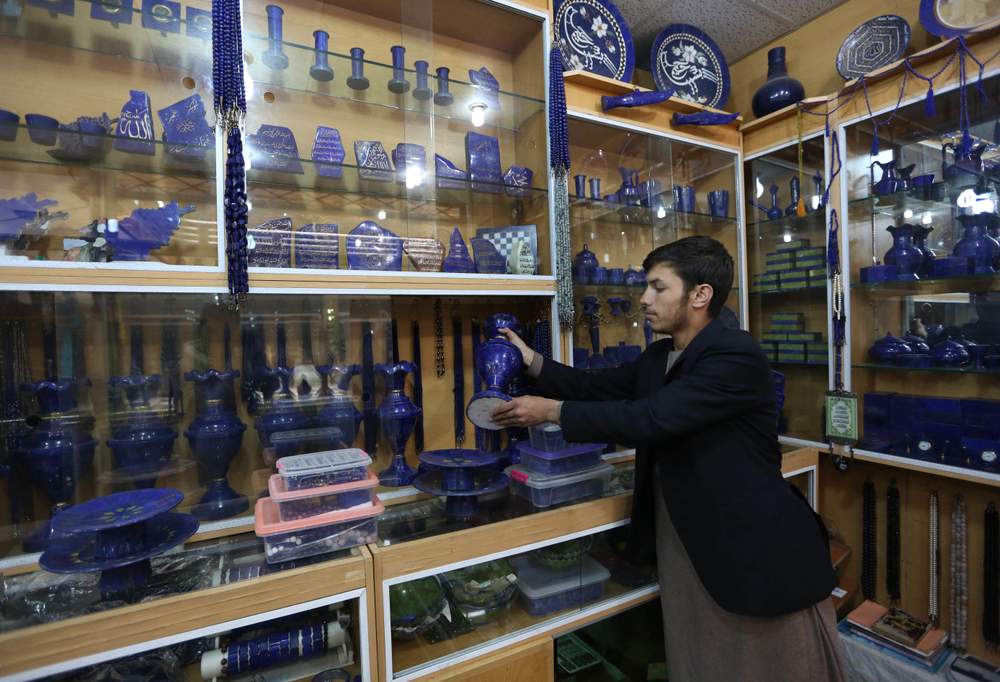 An Afghan lapis lazuli shopkeeper waits for customers in the city of Kabul, Afghanistan. Credit: AP Photo\/Rahmat Gul