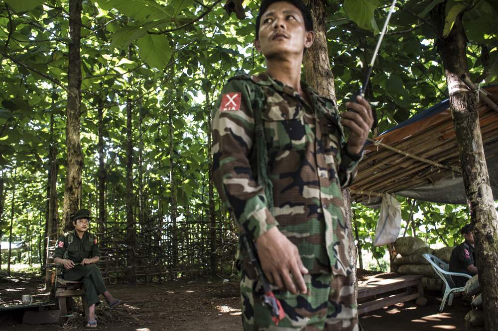 <em>Kachin Independence Army soldiers stand guard at a checkpoint.</em> <br /><em>Credit: Minzayar</em>